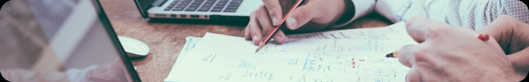 Business leaders reviewing financial data at an inflection stage, planning growth, investment, and strategic decisions for scaling operations